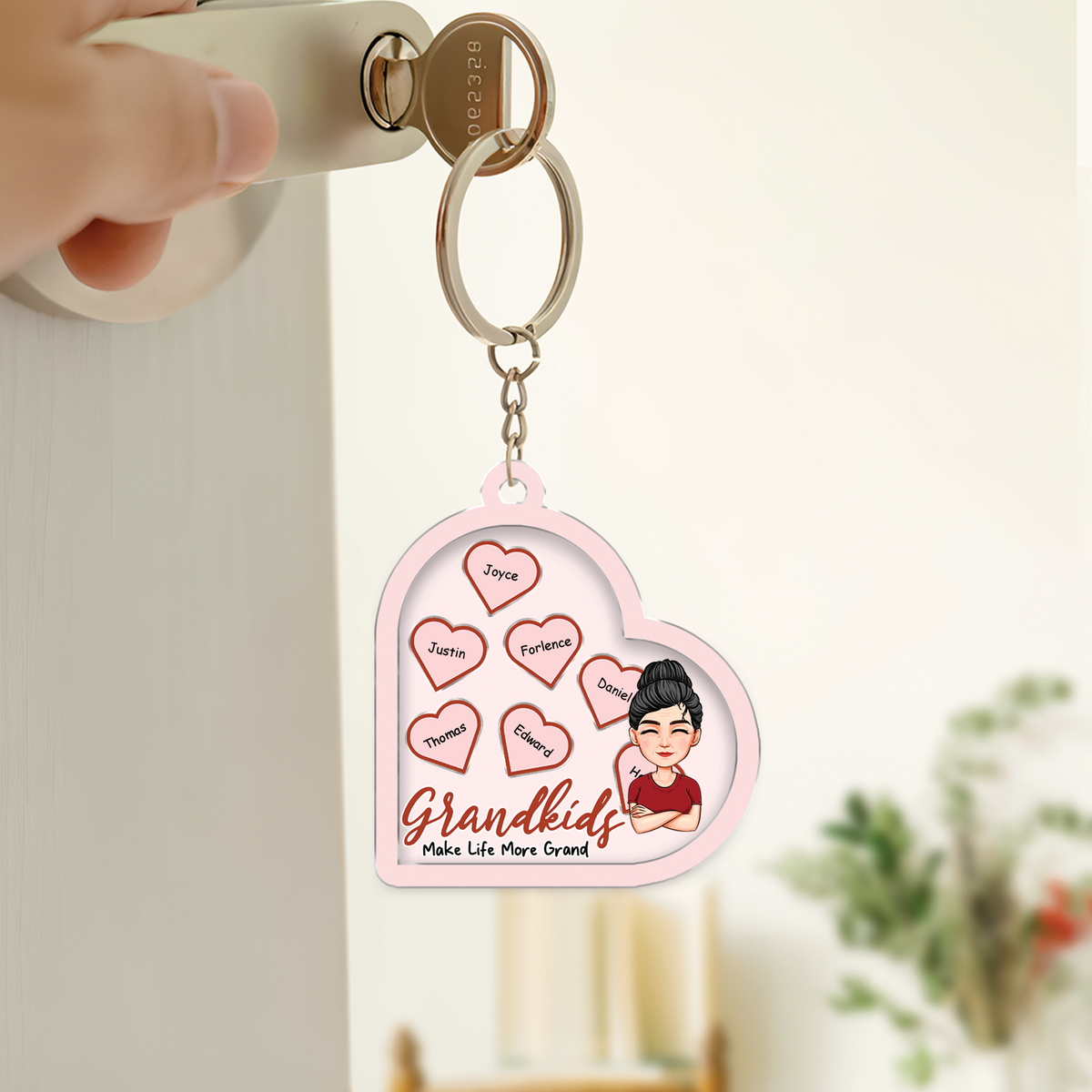 Personalized mom shaking keychain featuring heart design and names of grandchildren