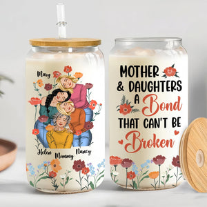 Personalized mother daughter glass can featuring floral design and uplifting message about family bonds