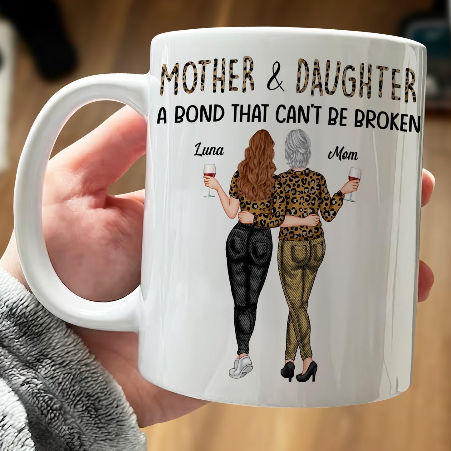 Personalized mother daughter mug featuring a design with two women holding drinks and the text about their bond