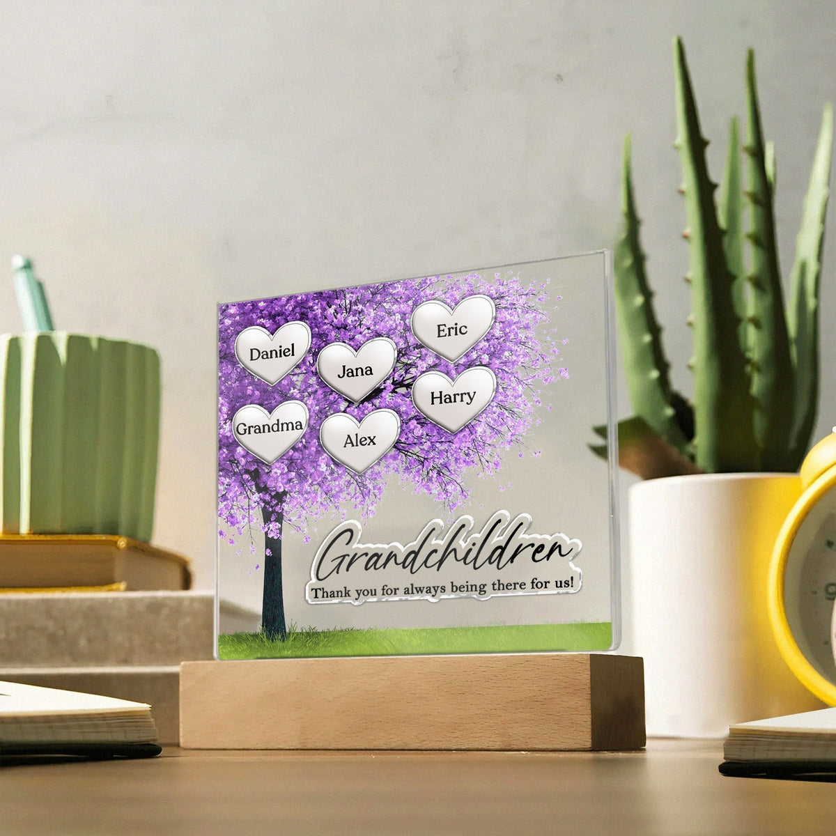 Personalized Mother's Day plaque with heart designs and names on display in a home setting