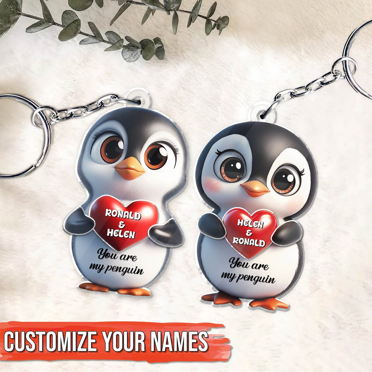 Personalized penguin couple keychain featuring custom names and heart designs for a unique gift