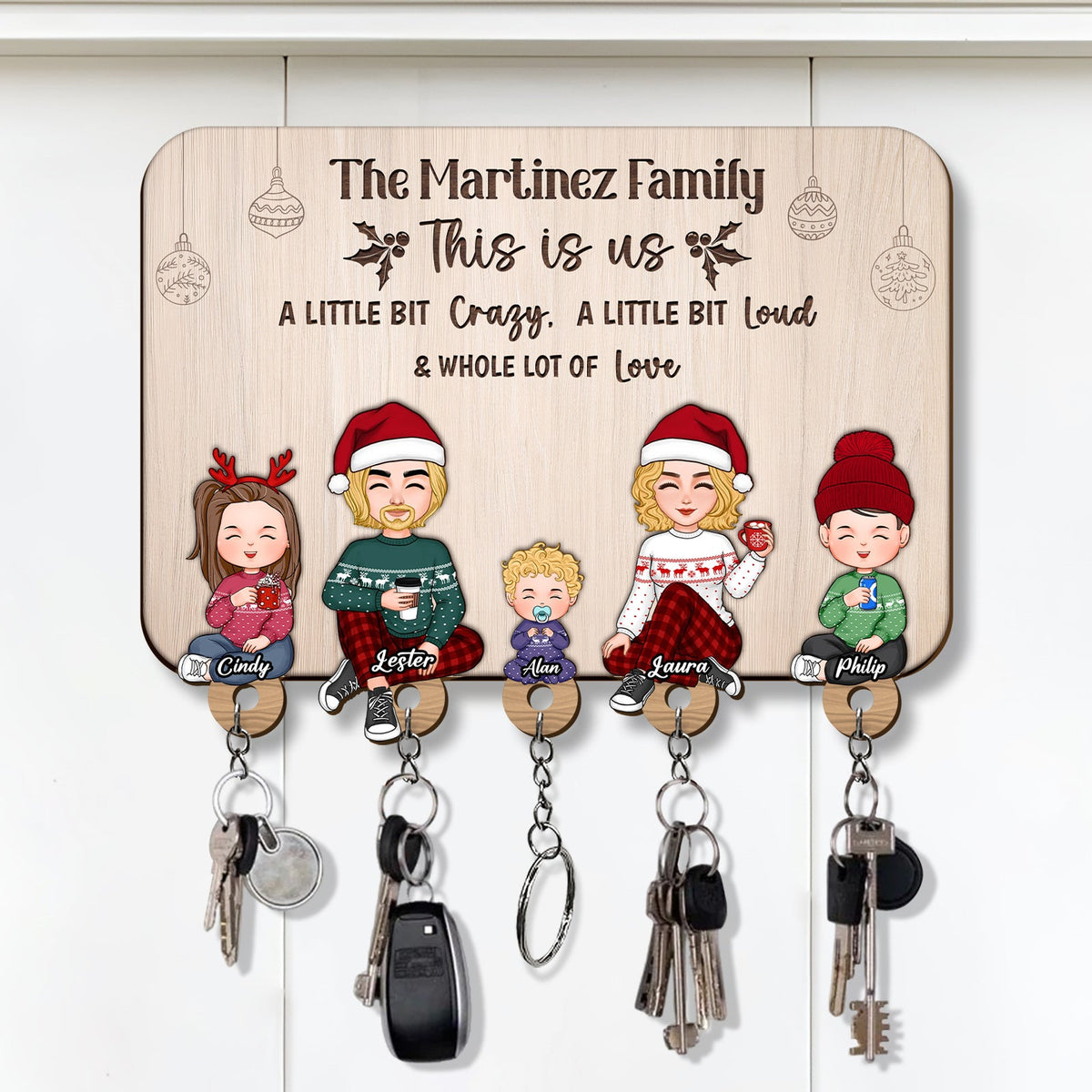 Personalized wooden key holder featuring the Martinez family with space for four keys