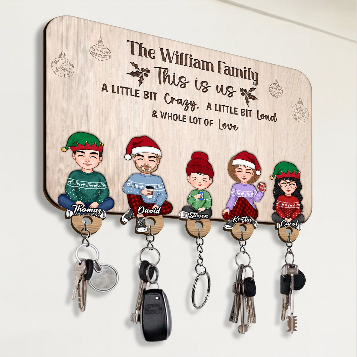 Personalized wooden key holder featuring cartoon family with hooks for keys and keychains