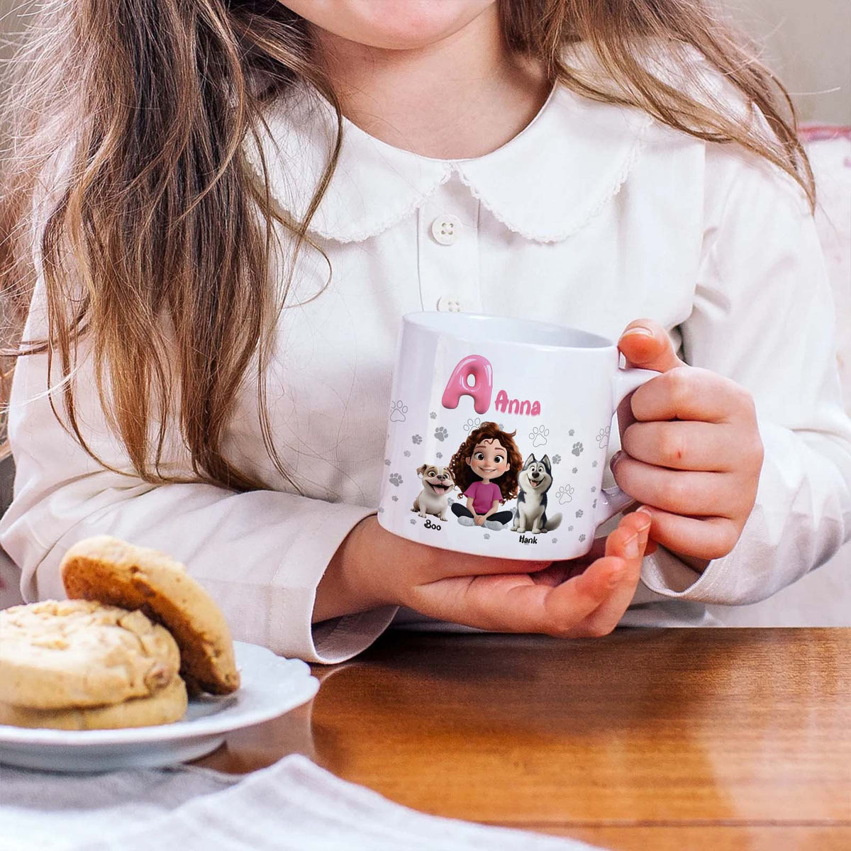 Child holding 365Gifty personalized pet lover mug with cartoon girl Anna and two dogs and cookies on table