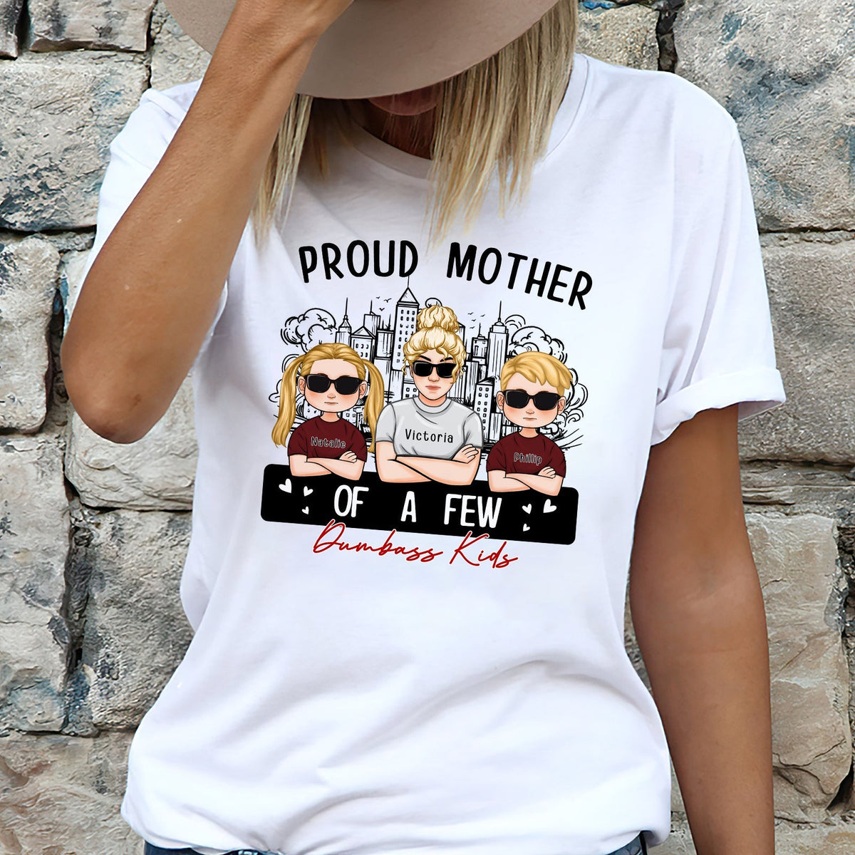 Women's T-shirt featuring the phrase proud mom of a few dumbass kids with cartoon kids graphics