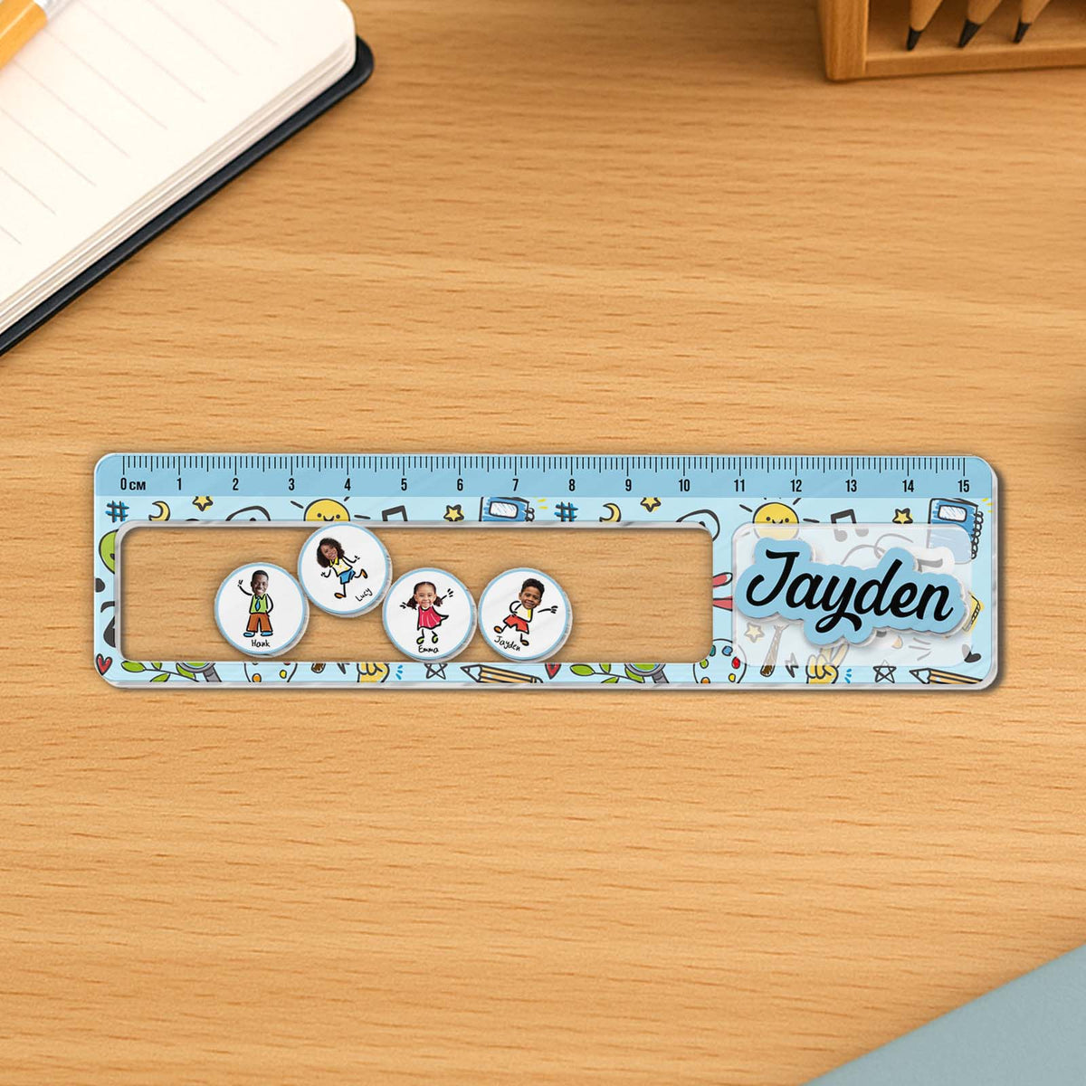365Gifty Shaking Ruler For Kids with playful cartoon characters and name Jayden on a wooden surface