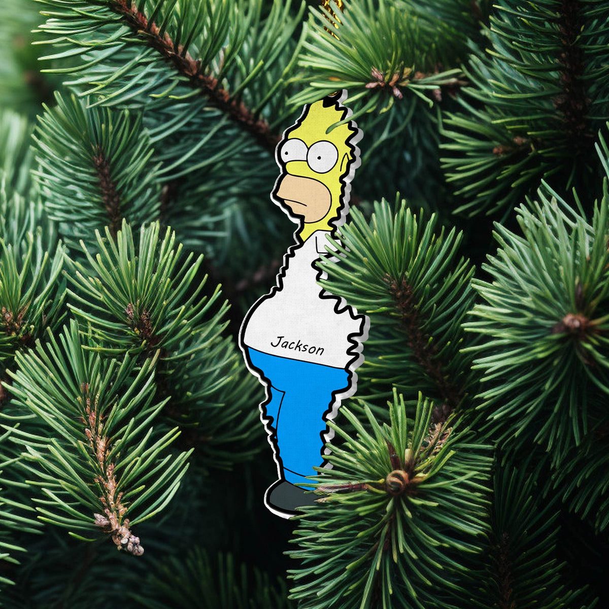 Personalized Christmas acrylic ornament featuring a cartoon character named Jackson hanging on green pine tree