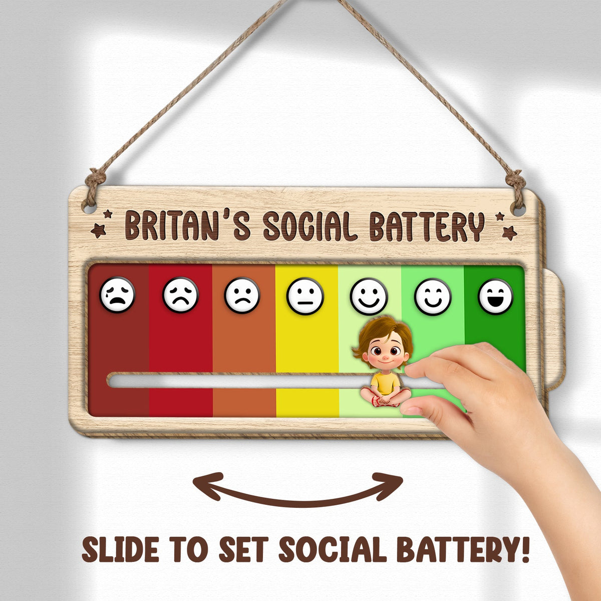 Wooden personalized door sign showing a sliding social battery meter with colored faces and a hand adjusting it
