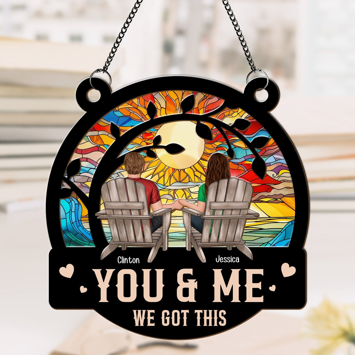 Personalized couple suncatcher ornament showing a couple holding hands on chairs with a colorful sunset background