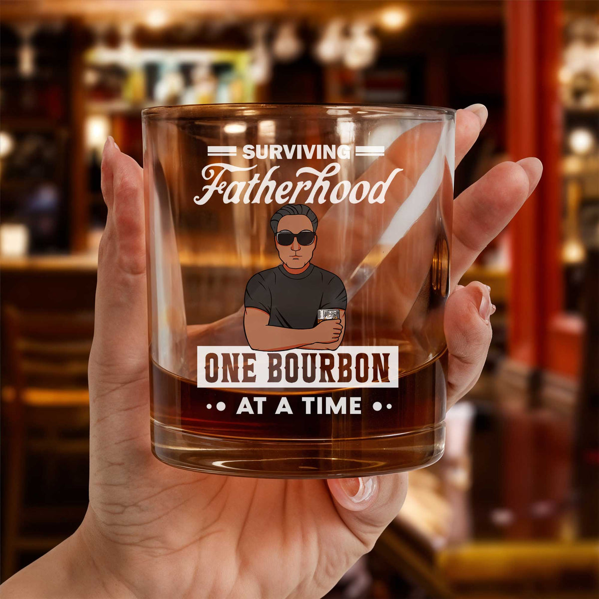 Personalized Whiskey Glass showing Surviving Fatherhood One Bourbon at a Time design with dad illustration