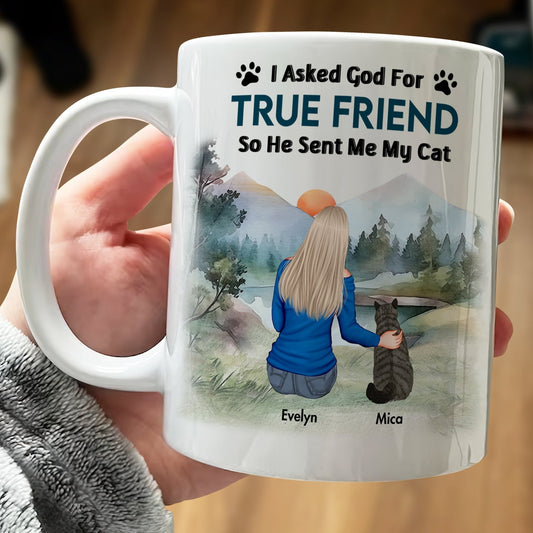 Unique pet memorial mug featuring a woman with her cat and a scenic background