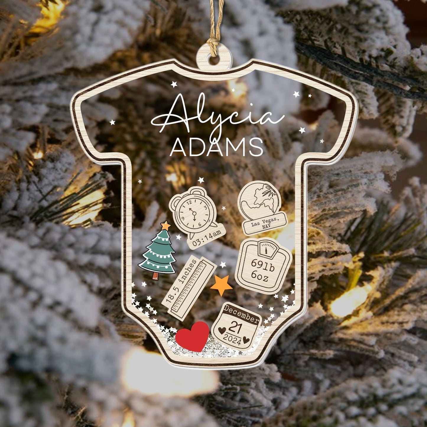 Personalized baby's first Christmas ornament shaped like a onesie with name and birth details