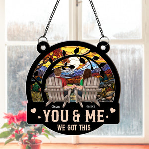 Personalized couple suncatcher ornament featuring a couple holding hands with a colorful sunset background